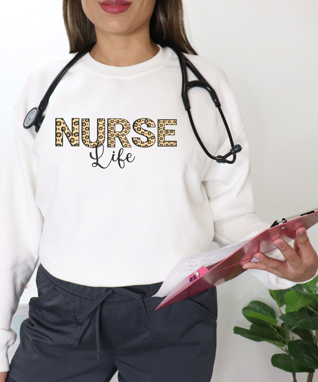 Sweater for nurses with word nurse in  leopard print with life in black print underneath